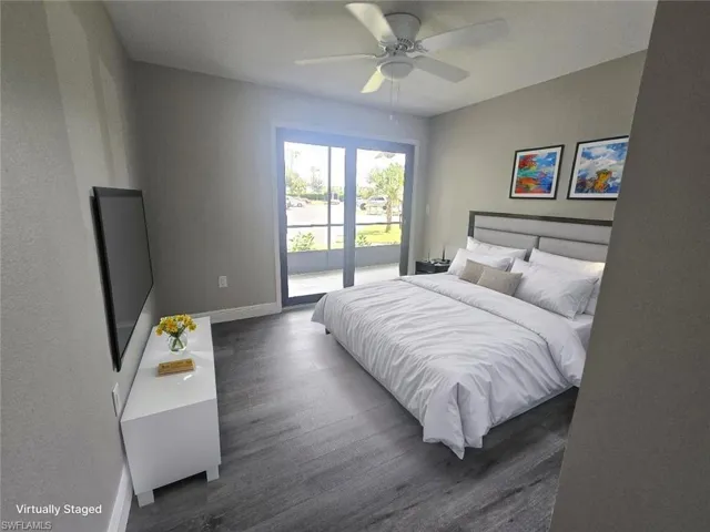 Virtually Staged 2nd Bedroom with Impact door to patio.