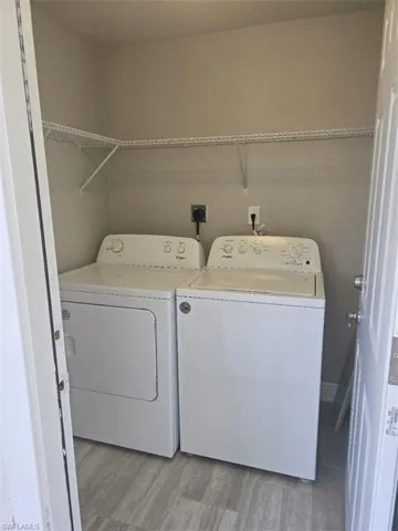 NEW Washer/Dryer with wire shelving.