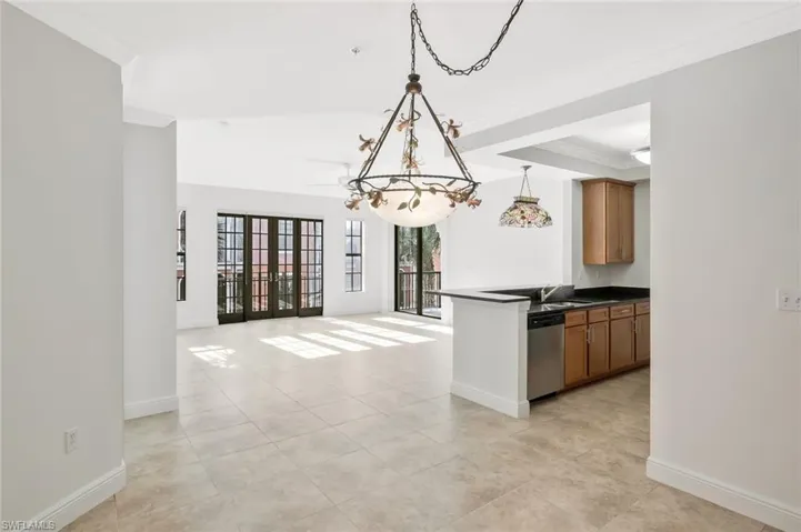 Dining area in the great room with custom lighting over area for dining table
