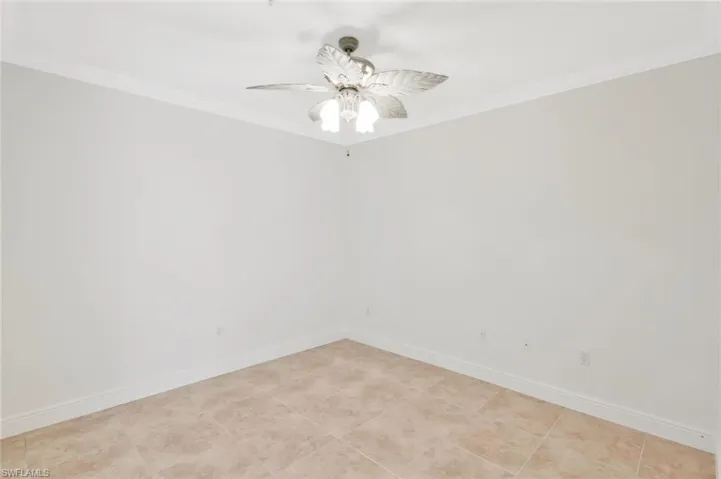 Den with crown molding. Den can double as dining room or office