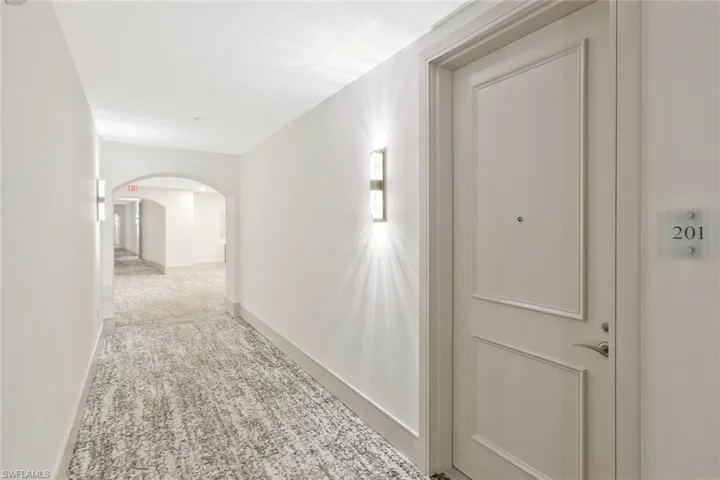 Entry door to residence, hallway and close proximity to elevator