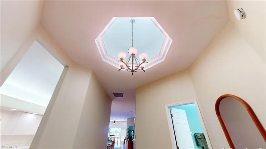 Corridor with a chandelier