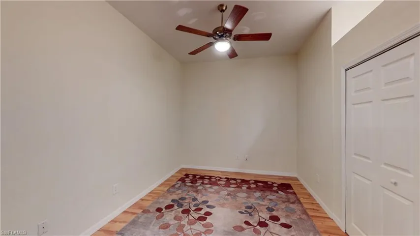 Spare room featuring light wood-type flooring and a ceiling fan