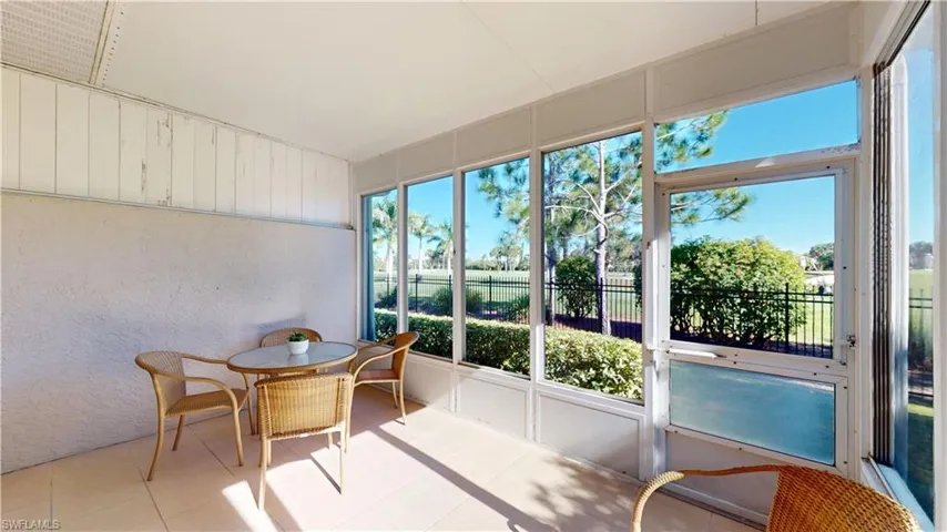 Sunroom featuring tile patterned floors