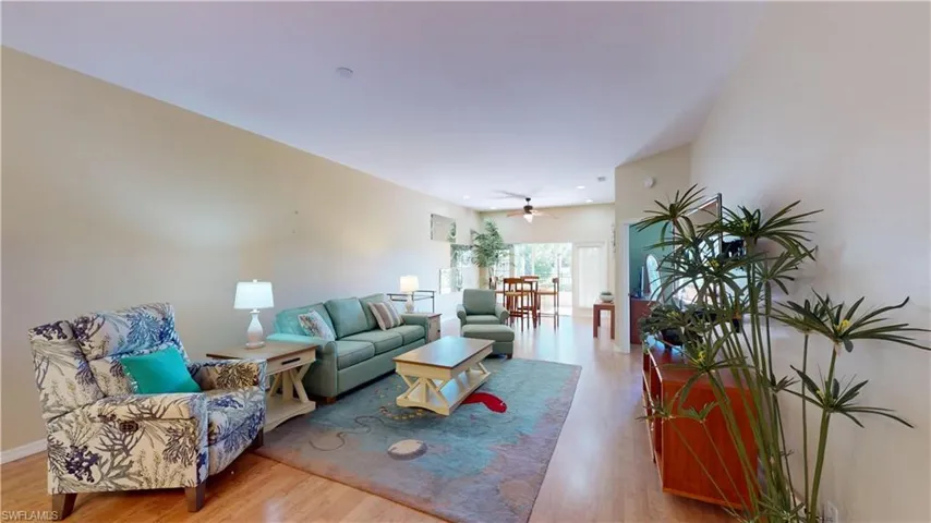 Living room featuring light wood-style floors and ceiling fan