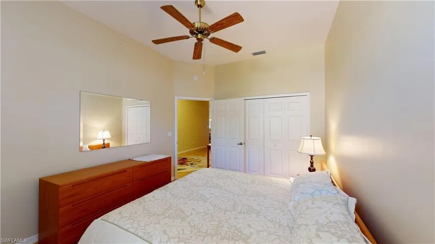 Bedroom featuring a closet and a ceiling fan