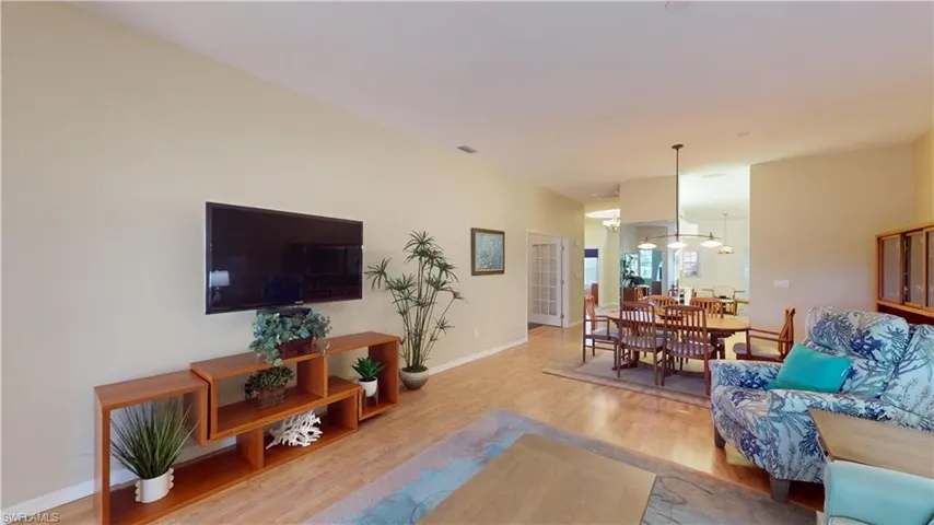 Living area featuring wood finished floors and baseboards