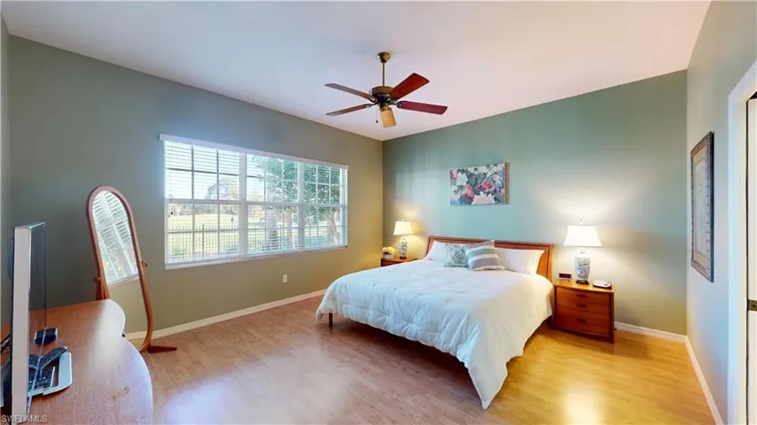 Bedroom featuring wood finished floors and ceiling fan