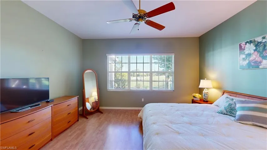 Bedroom featuring light wood-style flooring and ceiling fan