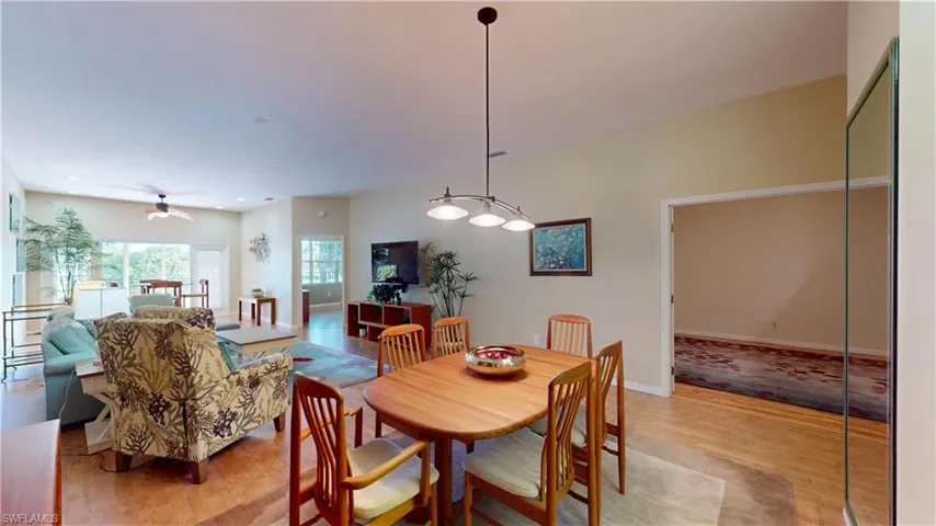 Dining room with wood finished floors, ceiling fan, and recessed lighting