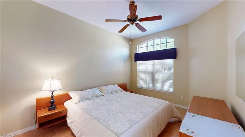 Bedroom featuring wood finished floors and ceiling fan