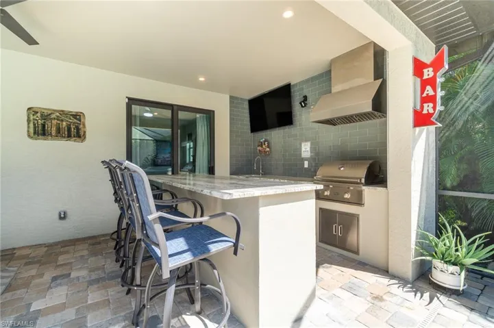 View of summer kitchen and wet bar