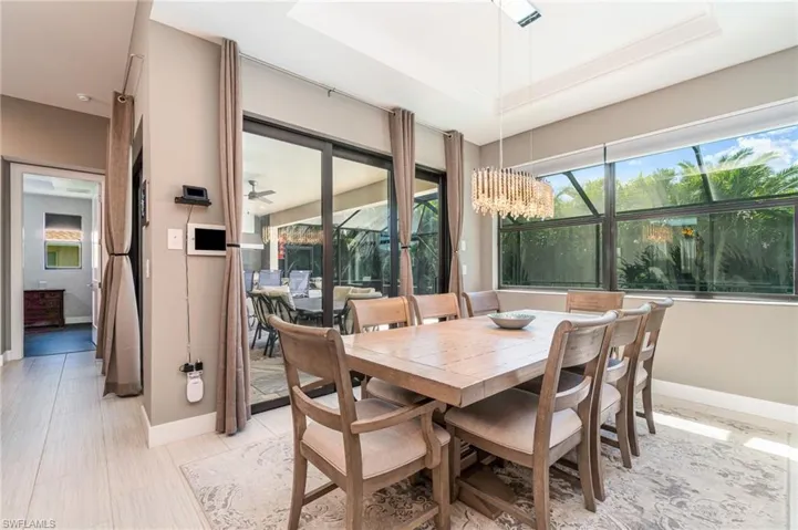 Dining space featuring a chandelier and a tray ceiling