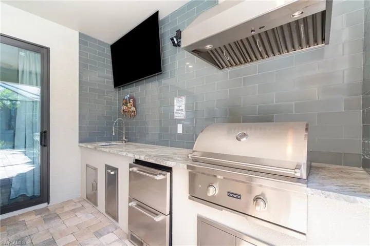 View of lanai with grilling area and sink