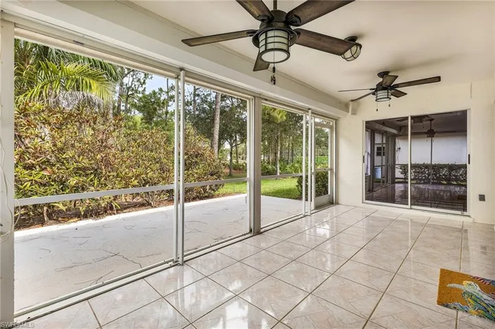 The west-facing screened lanai has been freshly painted, offers a private, serene view of the backyard, and has electric storm shutters.