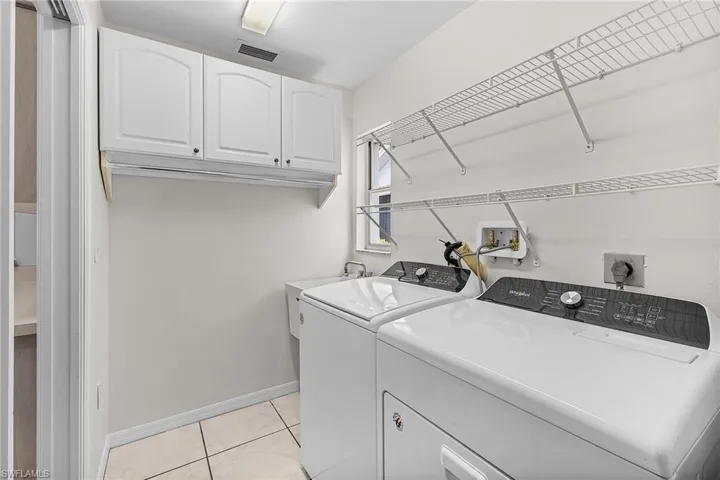 The in-residence laundry room has newer, separate washer and dryer, and laundry tub.