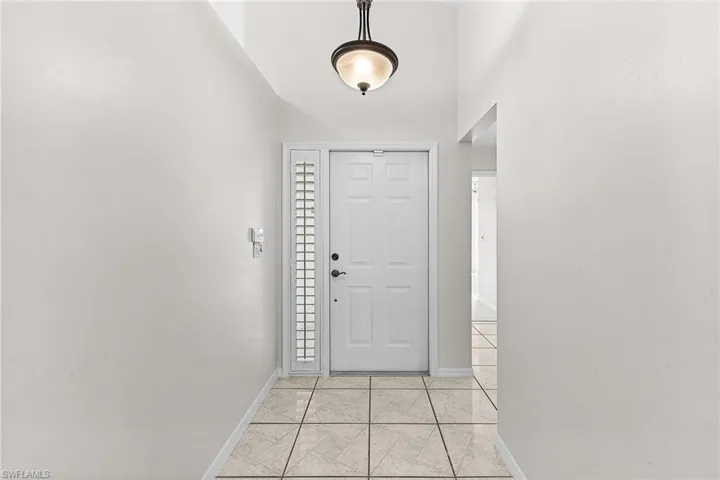 Front door with plantation shutter on the side window