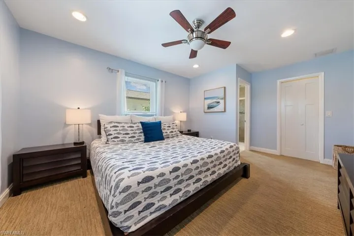 Bedroom with baseboards, recessed lighting, visible vents, and light colored carpet