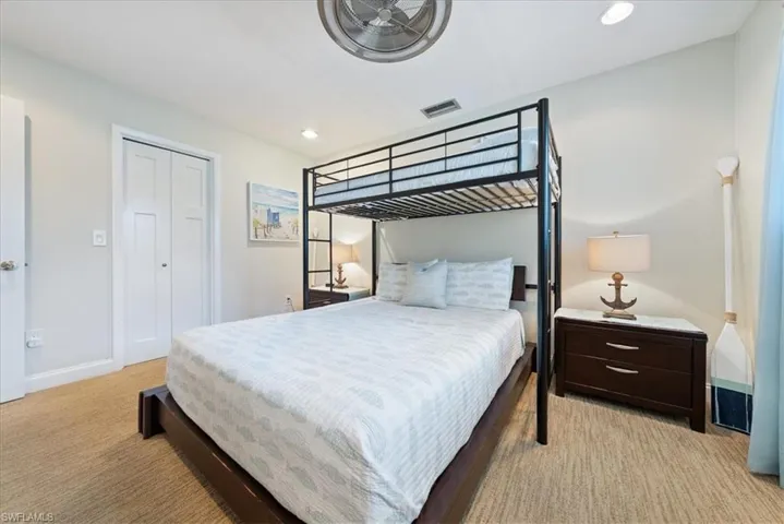 Bedroom featuring recessed lighting, visible vents, baseboards, and light carpet