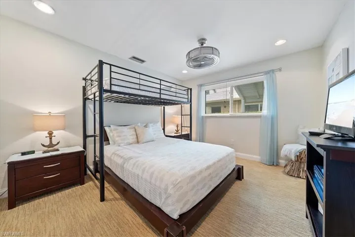 Bedroom featuring baseboards, recessed lighting, and visible vents