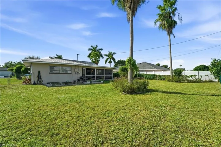 Back of property featuring a sunroom