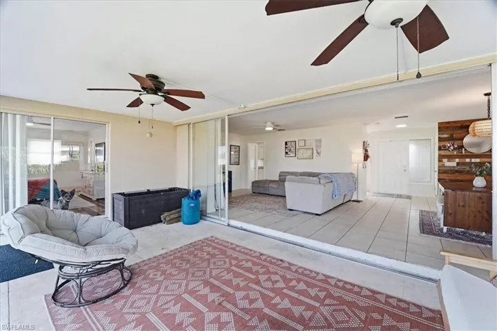 Living room with light tile patterned floors