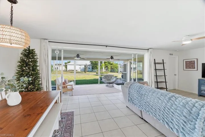 Bedroom featuring access to outside and light tile patterned flooring