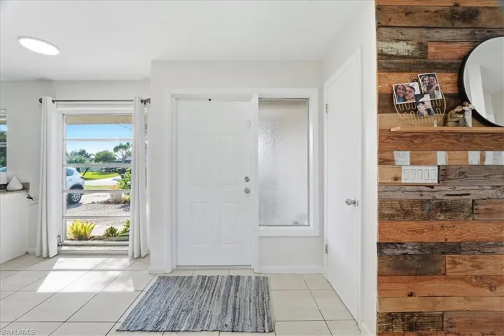 Foyer featuring light tile patterned floors