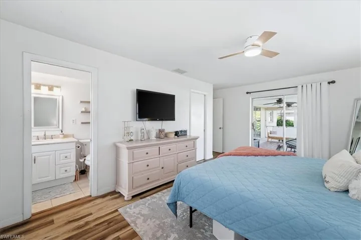 Bedroom featuring access to outside, a ceiling fan, and light wood-type flooring