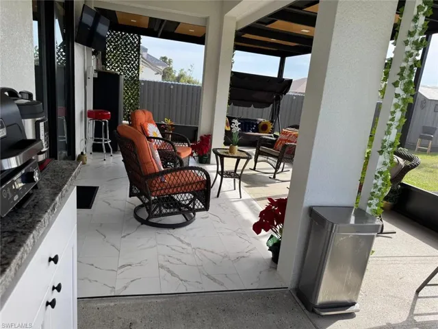 View of patio / terrace featuring fence