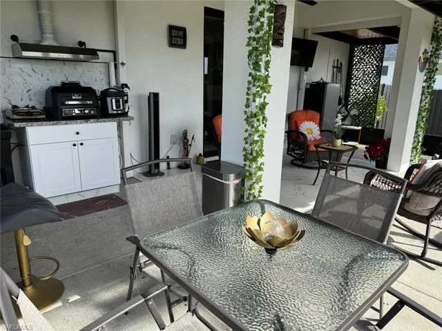 View of patio featuring outdoor dining area