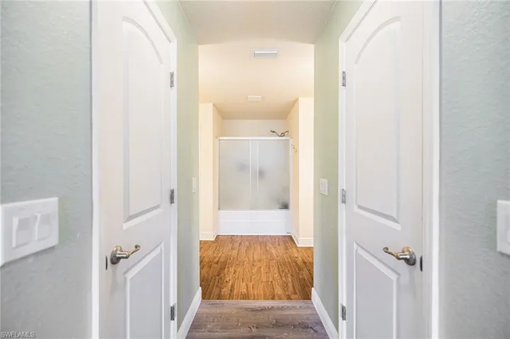 Corridor with wood-type flooring