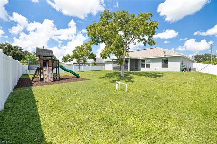 View of yard featuring a playground