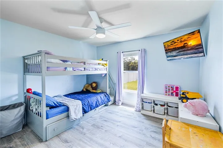 Bedroom with wood-type flooring and ceiling fan