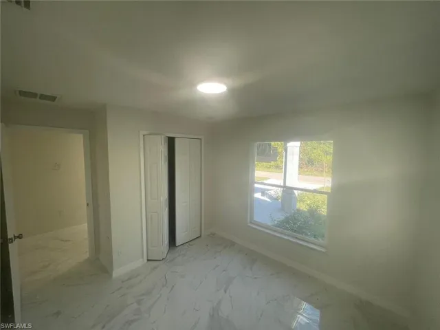 Unfurnished bedroom featuring a closet