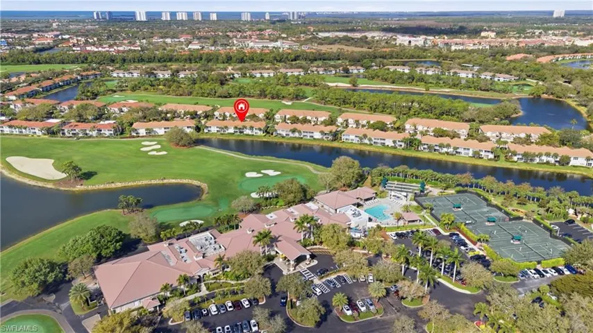 Aerial overview of property's location with a nearby body of water and a golf club
