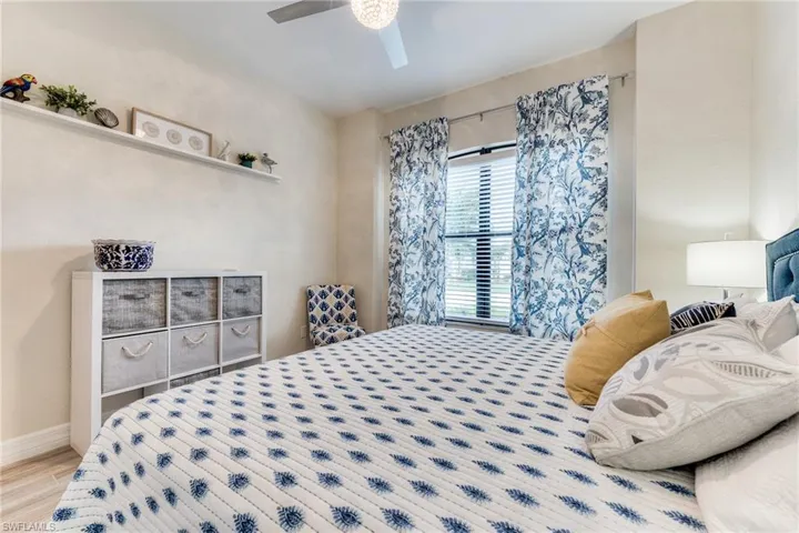 Pretty colors adorn this good size guest room.