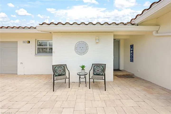 View of patio featuring a garage