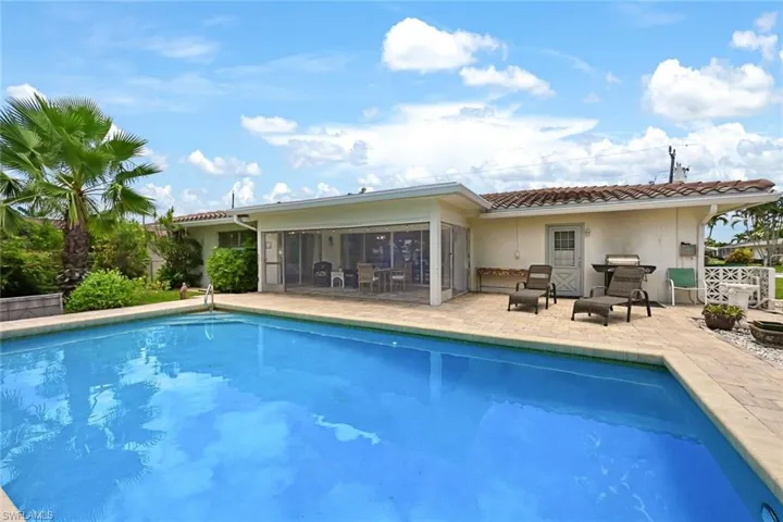 View of swimming pool with a patio area
