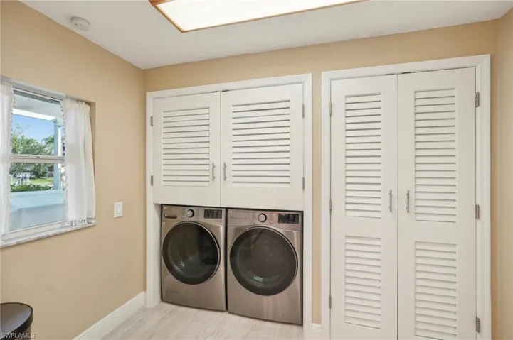Laundry room featuring washer and clothes dryer