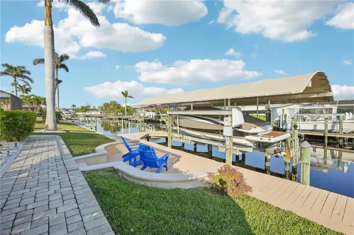 Dock area featuring a water view