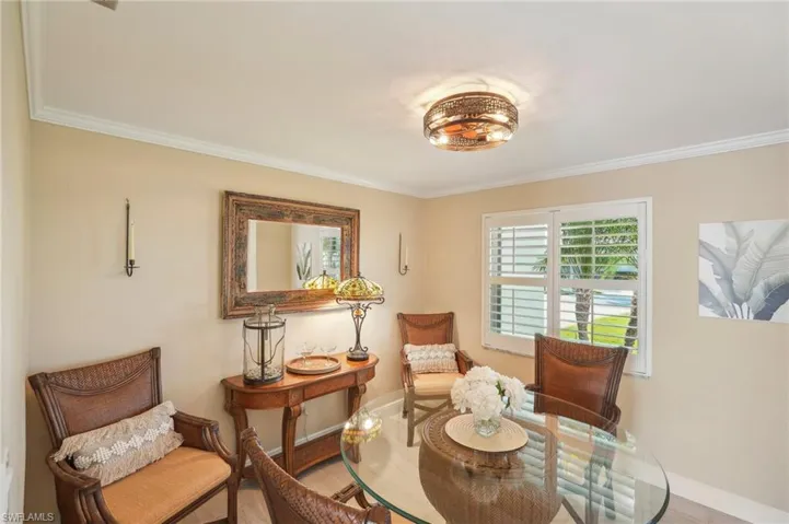 Sitting room featuring hardwood / wood-style flooring and ornamental molding