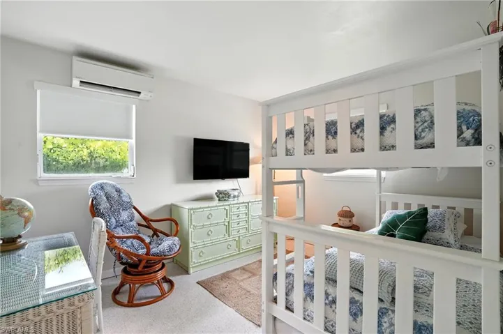 Bedroom with an AC wall unit