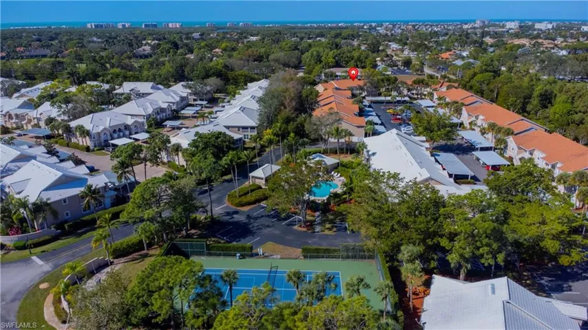 Aerial view of residential area & community amenities.