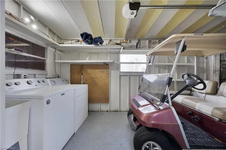 Laundry area with sink and independent washer and dryer