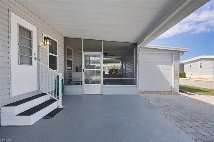 View of patio / terrace featuring a garage