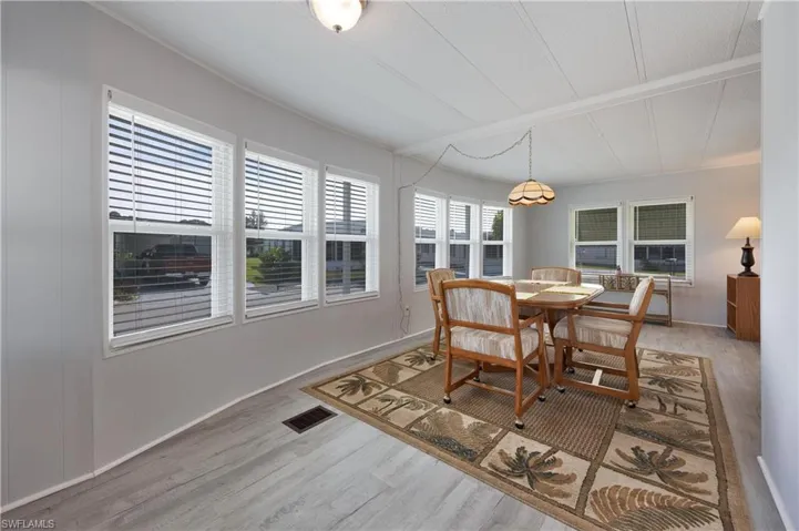 Dining area with hardwood / wood-style flooring