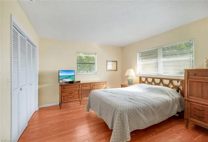 Bedroom with easy care laminate wood flooring