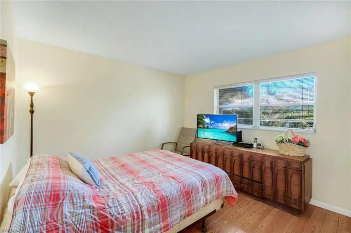 Bedroom with laminate wood flooring