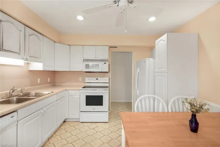 Kitchen featuring white cabinetry